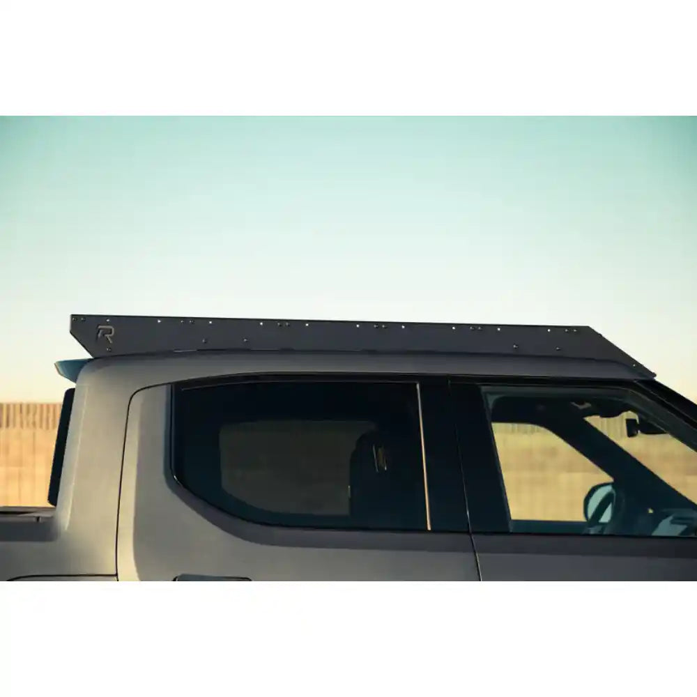 Rago low-profile roof rack on Rivian R1T cab, side view