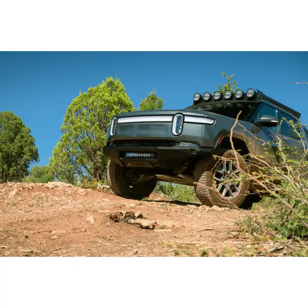 Rivian R1T with Rago roof rack on forest trail