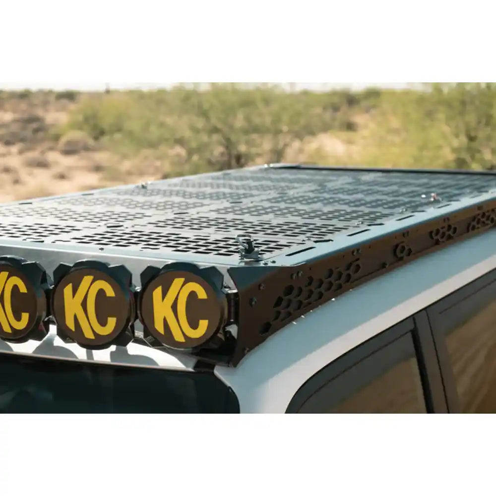 Rago 22 x 11 decking panels on Land Cruiser roof rack with KC lights