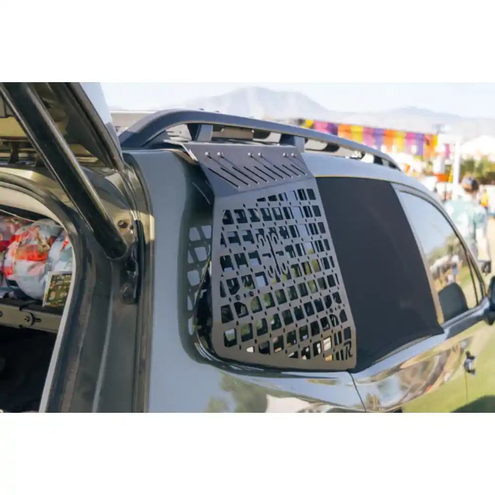 Rago exterior Molle panel installed on Subaru Forester at camp