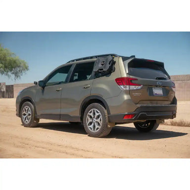 Subaru Forester with Rago exterior Molle panels, rear three-quarter view in desert