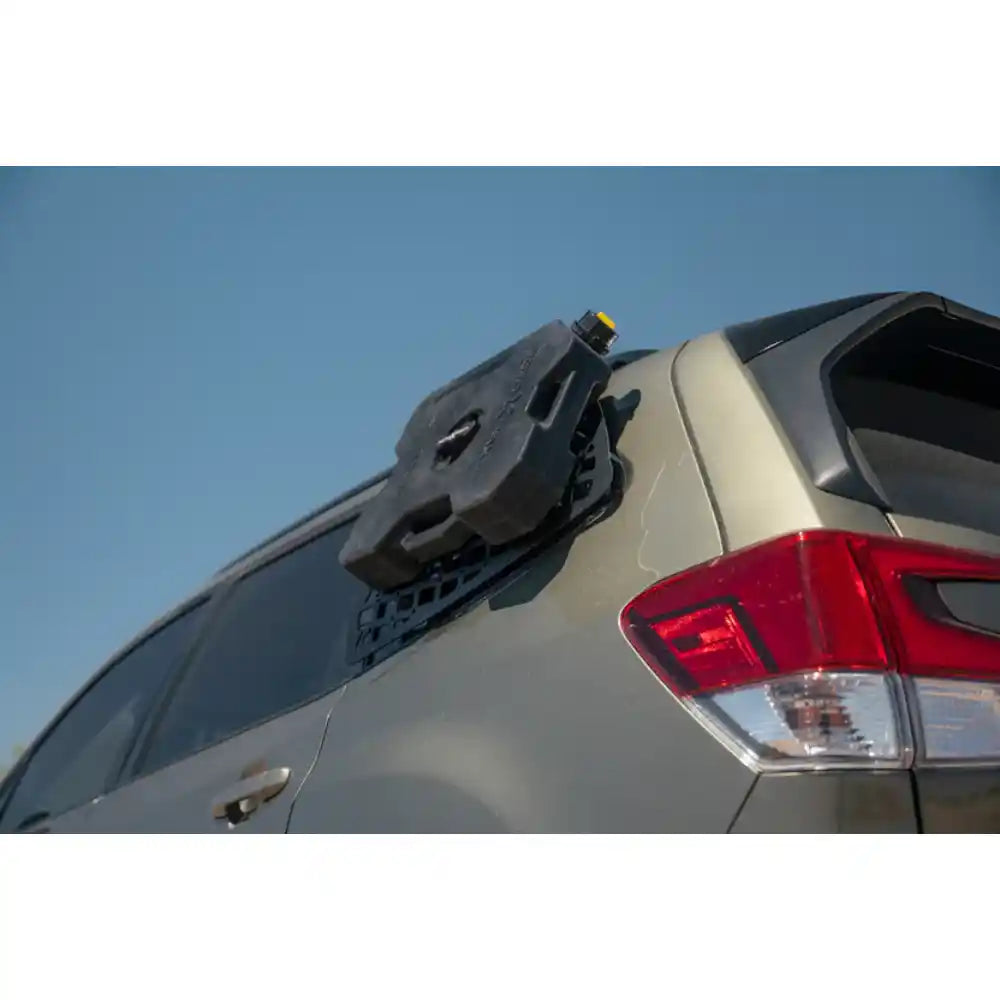 RotopaX container mounted on Rago exterior Molle panel, Subaru Forester
