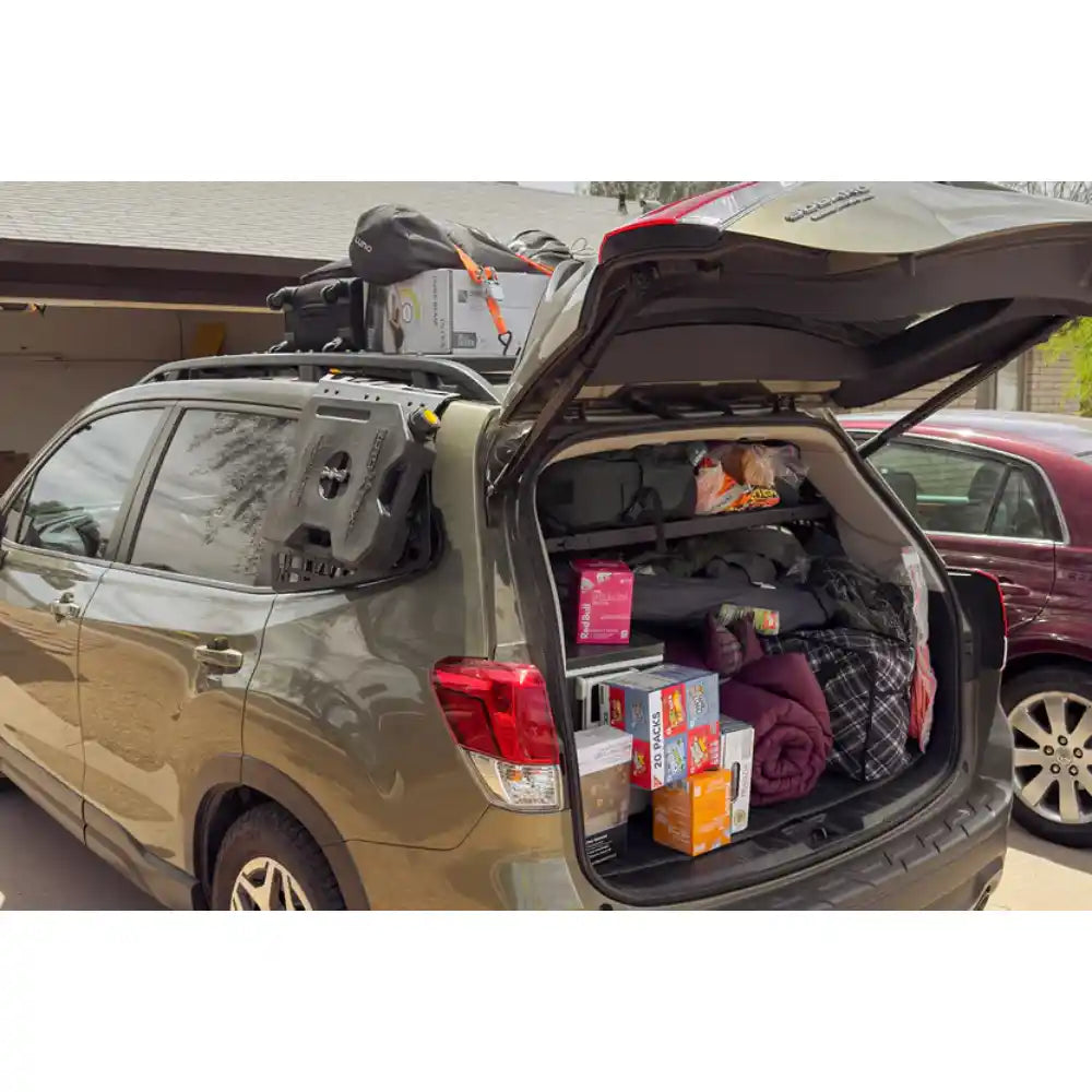 Packed Subaru Forester with rear hatch open and Rago Molle storage shelf