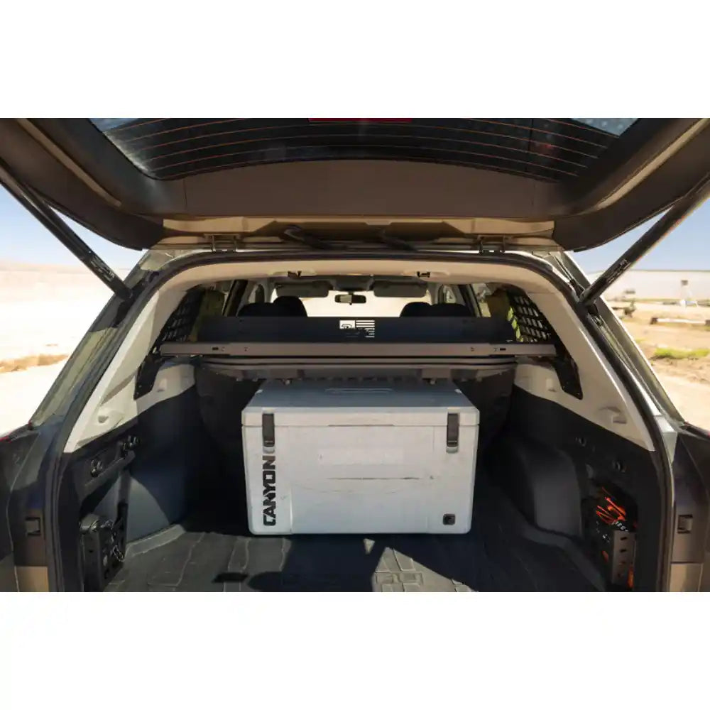 Rago Molle storage shelf above cooler in Subaru Forester trunk, rear view