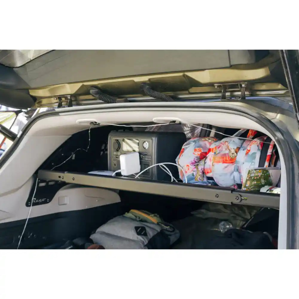 Rago Molle storage shelf holding gear across Subaru Forester cargo area