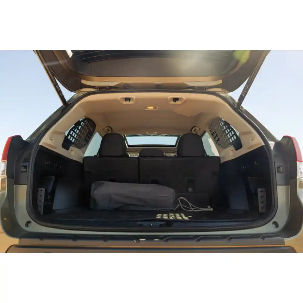 Subaru Forester cargo area with Rago rear window Molle panels on both sides