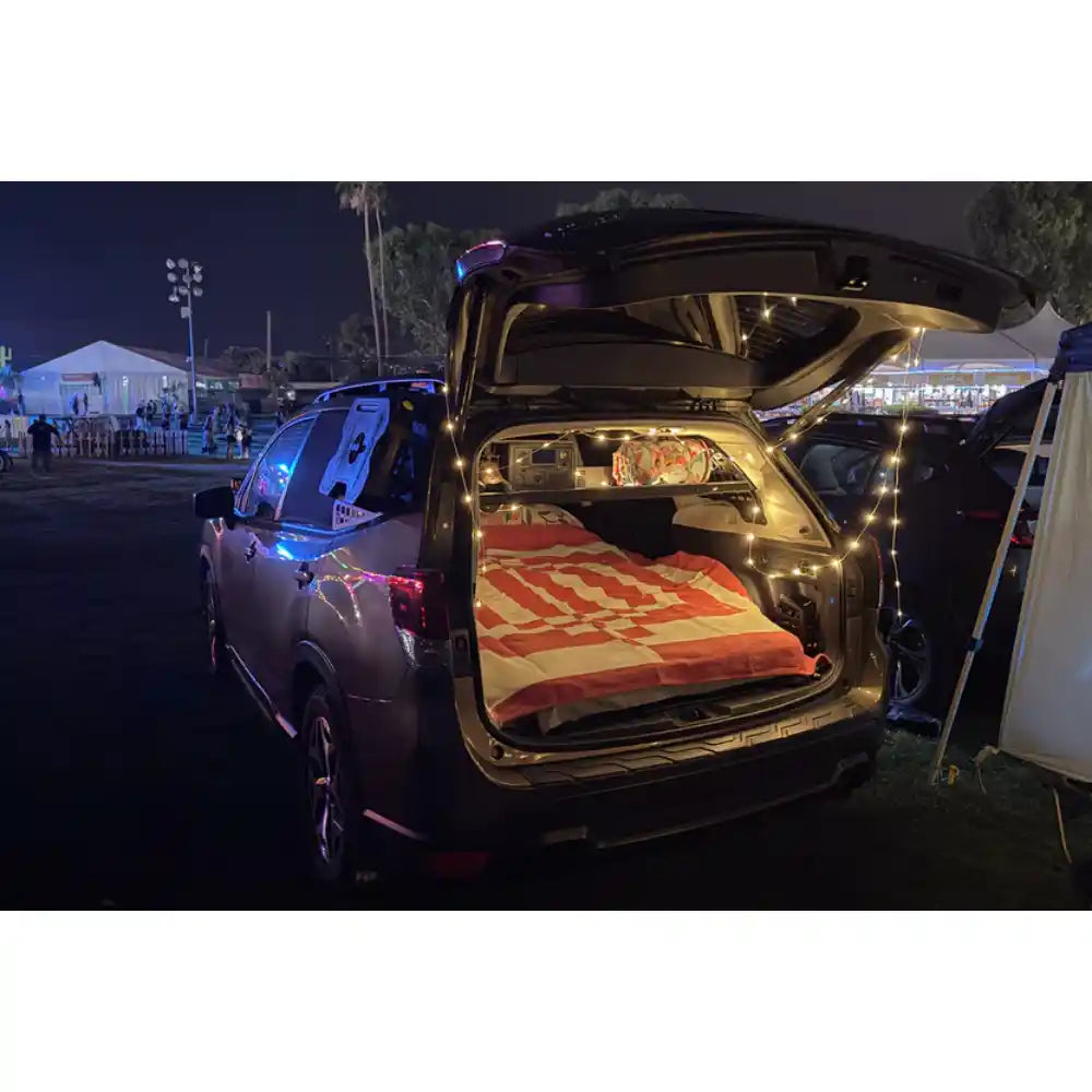 Subaru Forester at night with hatch open and Rago interior Molle panels