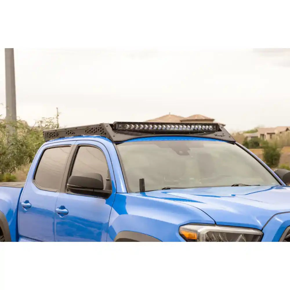 Rago light pocket roof rack on Tacoma cab, side view