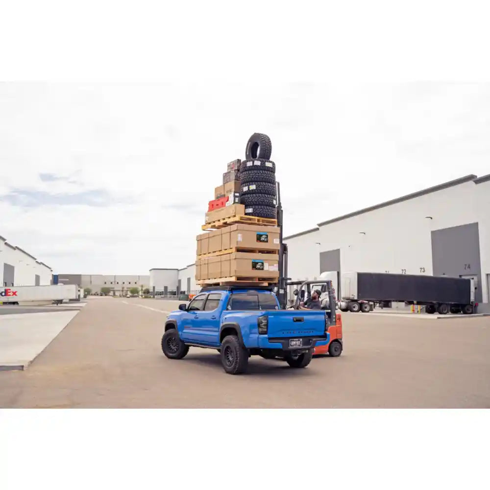 Rago Tacoma roof rack loaded for stress test, rear three-quarter