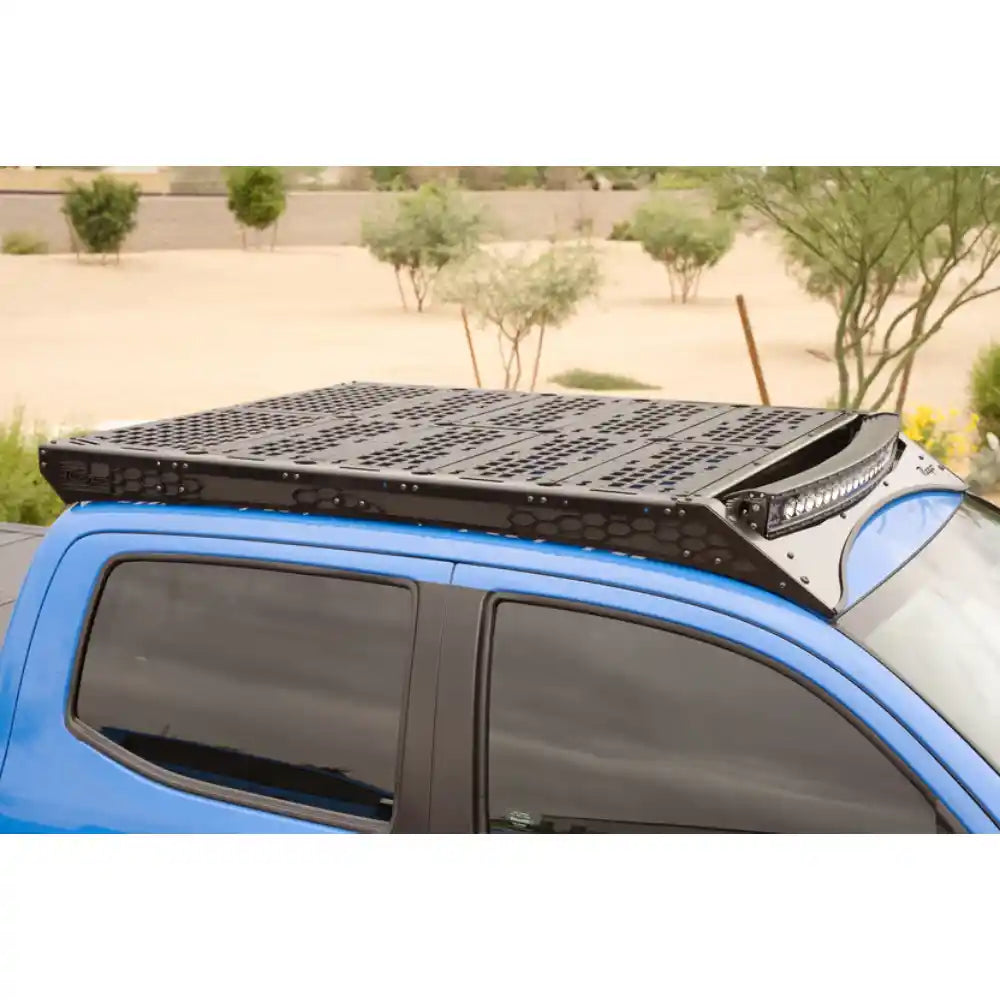 Rago light pocket rack with light bar above Tacoma windshield