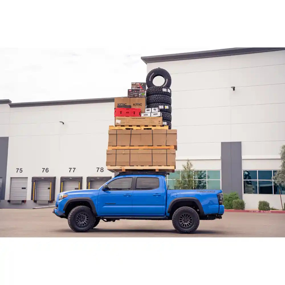 Rago roof rack load test on blue Tacoma, side view
