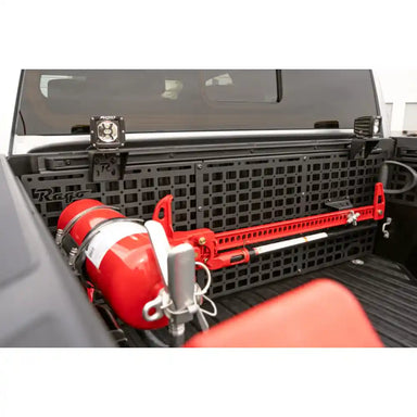 Rago Tacoma bed cab Molle panel with fire extinguisher and gear