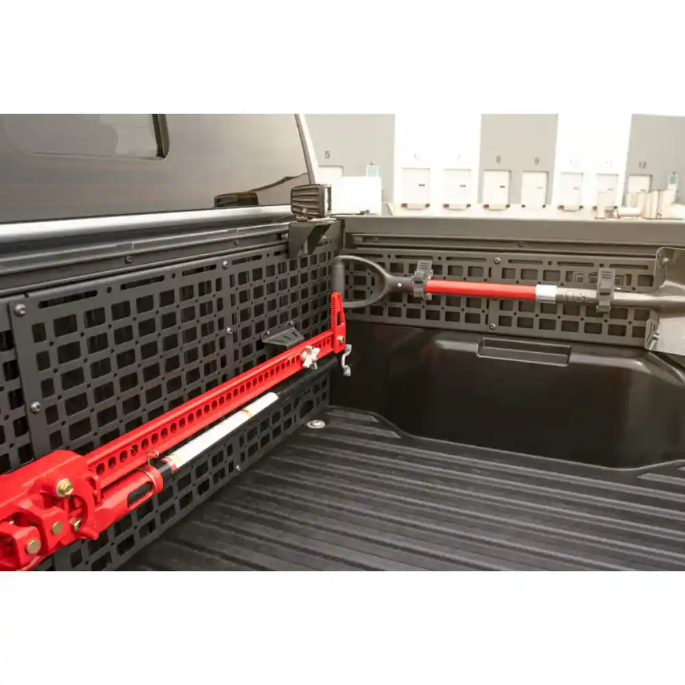 Rago Tacoma bed cab Molle panel with red gear, angled view