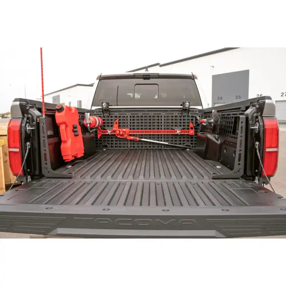 Rago Tacoma bed cab Molle panel with red gear