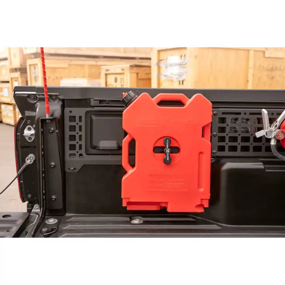 Rago Tacoma bed side Molle panel with red fuel can, close-up
