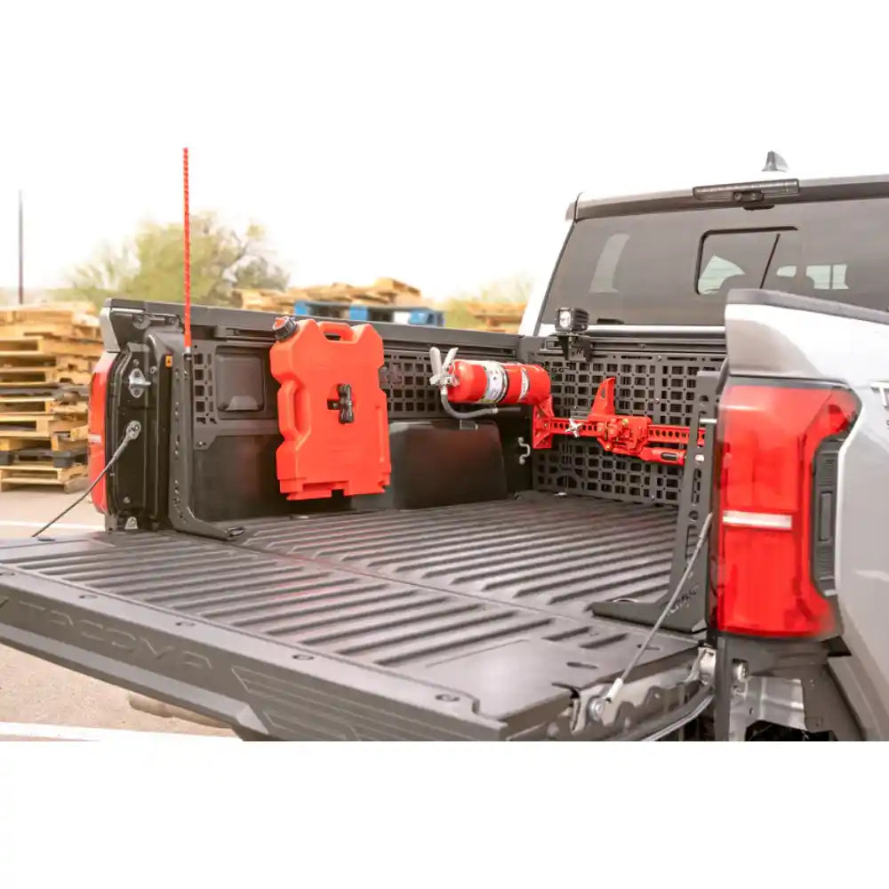2024 Tacoma bed with gear on Rago Molle panels outdoors