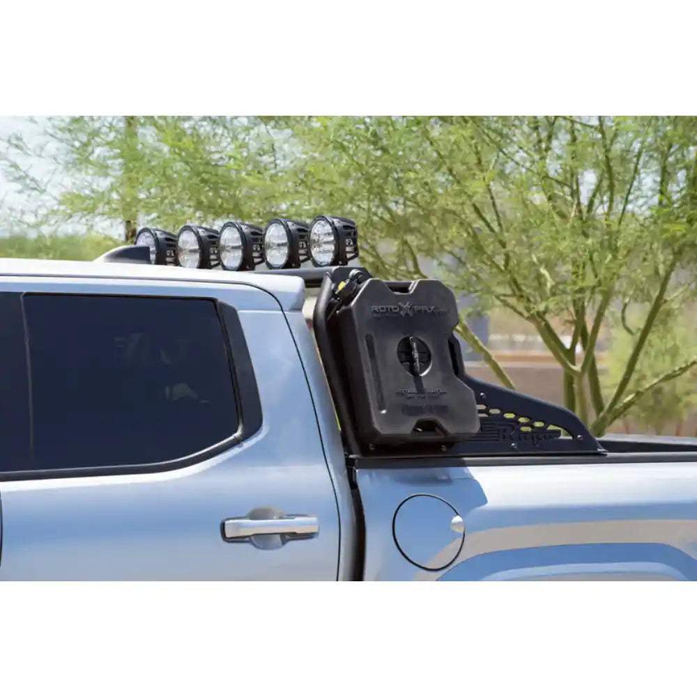 Tacoma with lights on Rago chase rack, side view