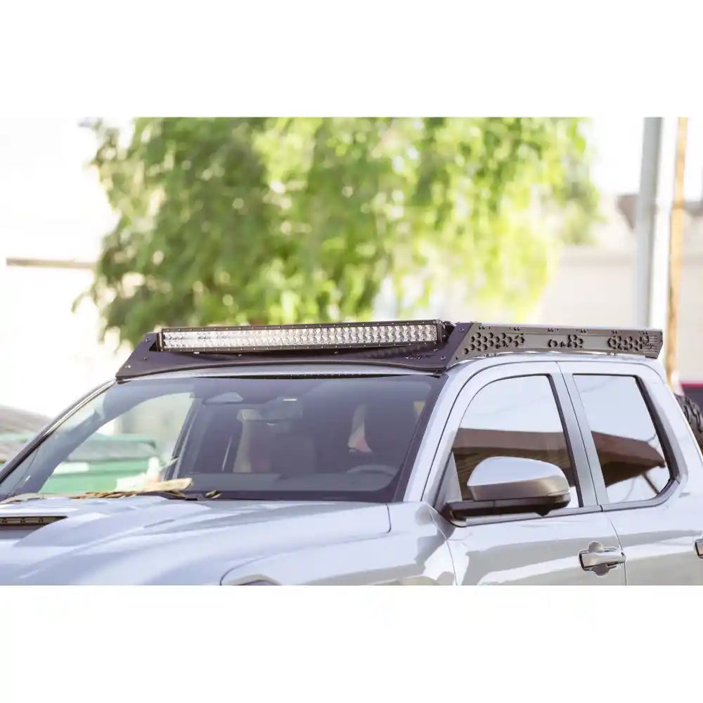 Rago light pocket roof rack with 40 inch light bar on Tacoma, front three-quarter