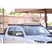 Toyota Tacoma with light bar in Rago roof rack, front view