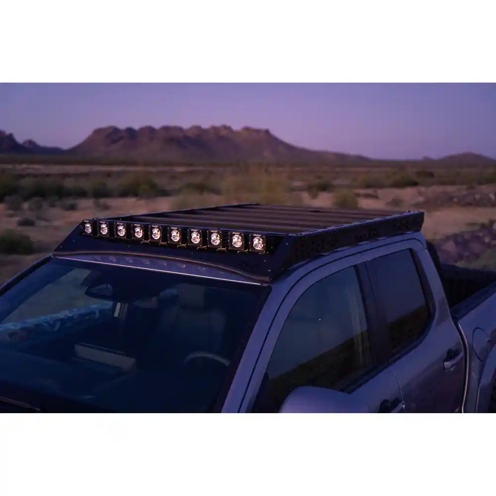 2024 Tacoma at dusk with pod lights in Rago roof rack light pocket