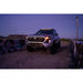 2024 Tacoma at night with pod lights lit in Rago roof rack