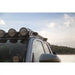 Round lights on Rago Tacoma roof rack, close-up against sky