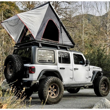 rival roof rack bracket kit with roof top tent mounted on it
