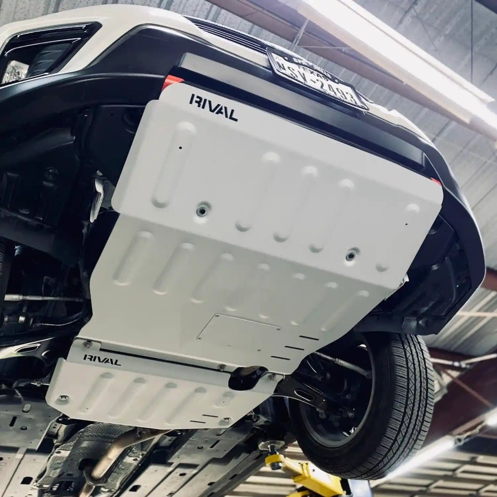 RIVAL Aluminum Engine Skid Plate installed on a Subaru Forester, showing underbody protection