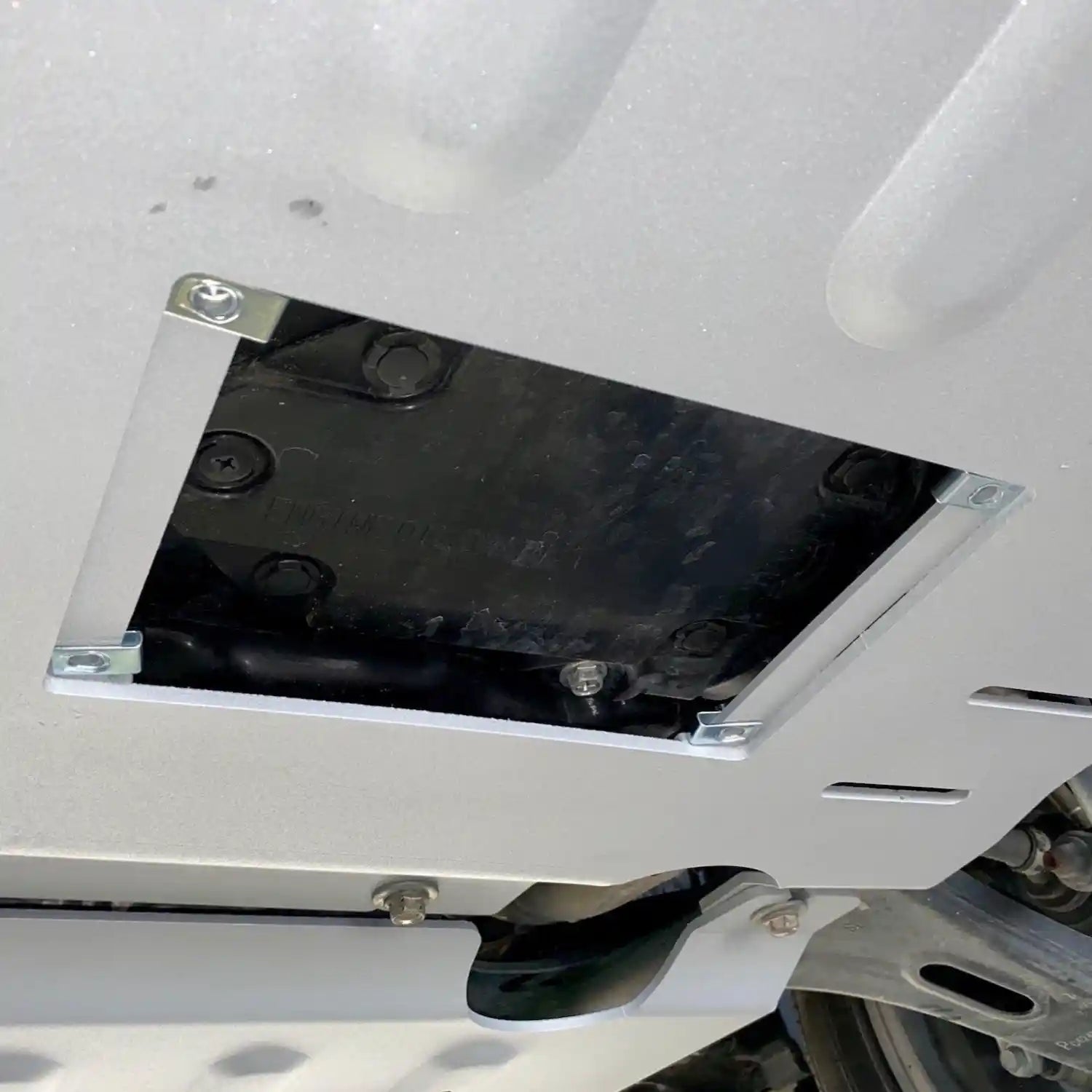 open hatch view of the Rival engine skid plate