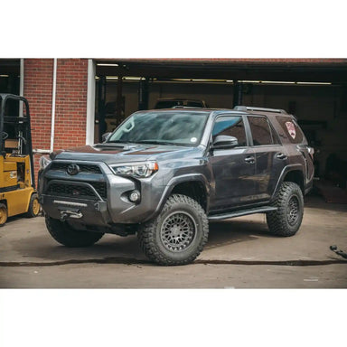 side view of the mounted RSG rock sliders on a gray 4runner