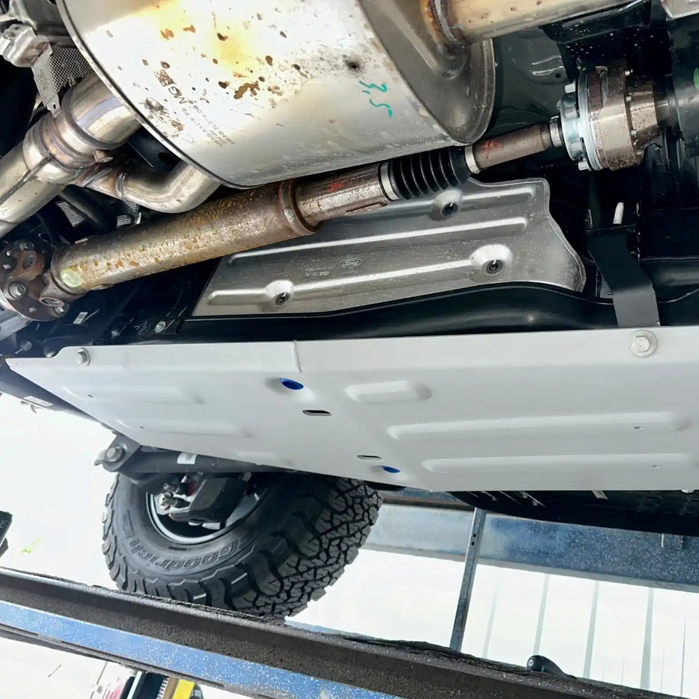 angled view to show the spacing between the skid plate and the gas tank