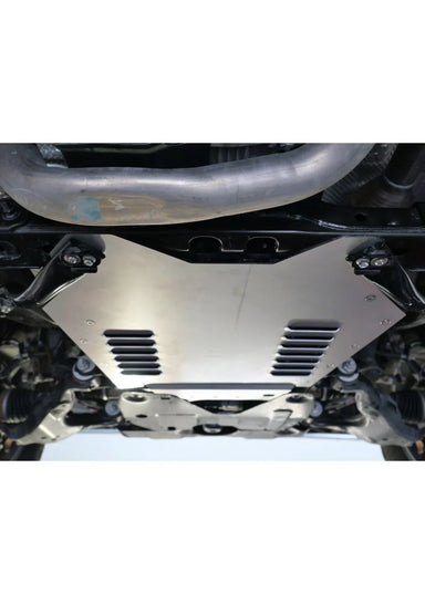 Under-vehicle view of the MillerCat Cat Shield installed on a Toyota Tacoma 3.5L 4WD, highlighting its fitment and coverage area.