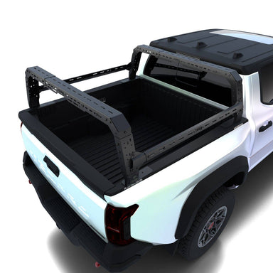 White Tacoma with a black bed cover by TUWA Pro and rack on a white background
