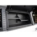 Open storage compartment with metal frame and black interior, showing 'backwoods' branding.