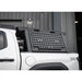 Truck bed with a black storage system on a white truck