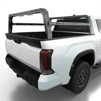 White Tundra truck with a TUWA Pro bed rack on a white background