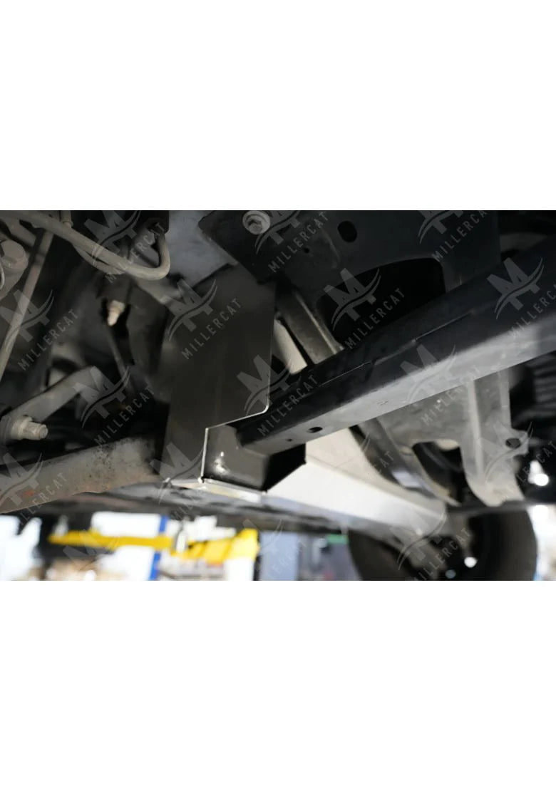 Close-up of a vehicle's undercarriage with a focus on mechanical components.